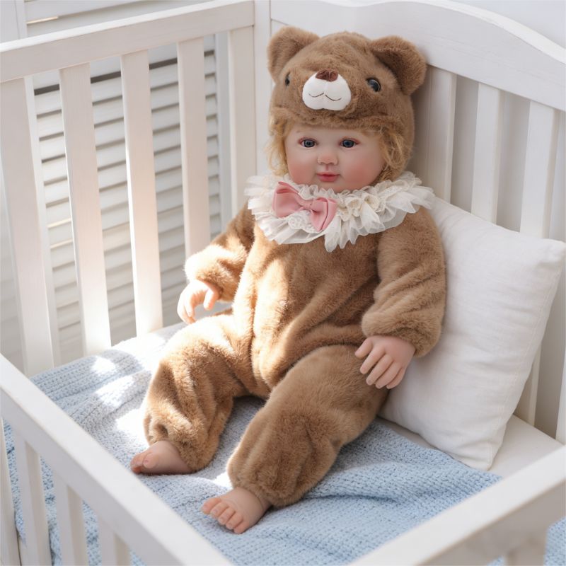 28-Inch Realistic Vinyl Baby Doll in Brown Plush Bear Suit – Hand-Painted Collectible with Blue Acrylic Eyes